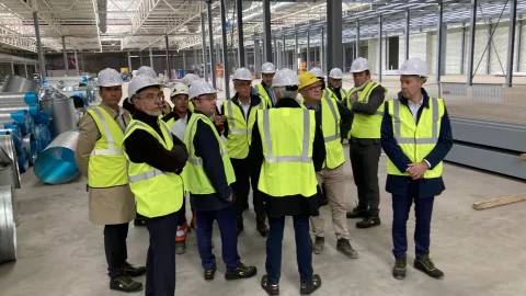 Excom members in ACC's gigafactory