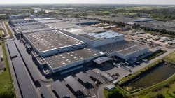 Photo of the gigafactory's main parking lot, covered with photovoltaic shades.