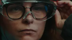 Photo of an ACC employee adjusting safety glasses, from the 4 years anniversary movie